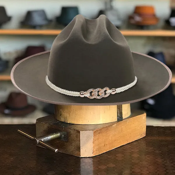 Classic Wide-Brim Green Cowboy Hat with Elegant Silver Rope Band and Buckle